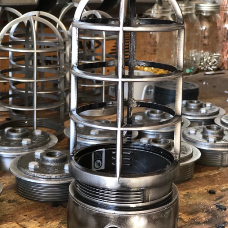 Cage light, gritty glamor, beside lamp