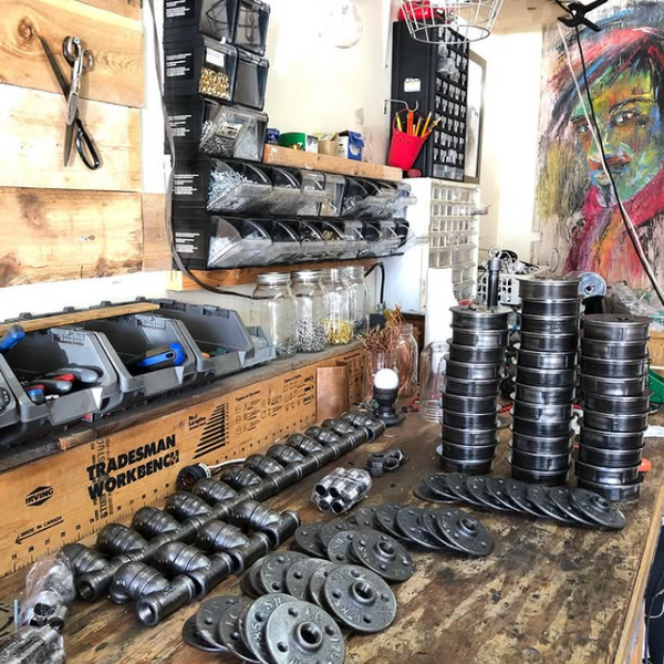 Industrial-style black pipe light for rustic workshop or bench