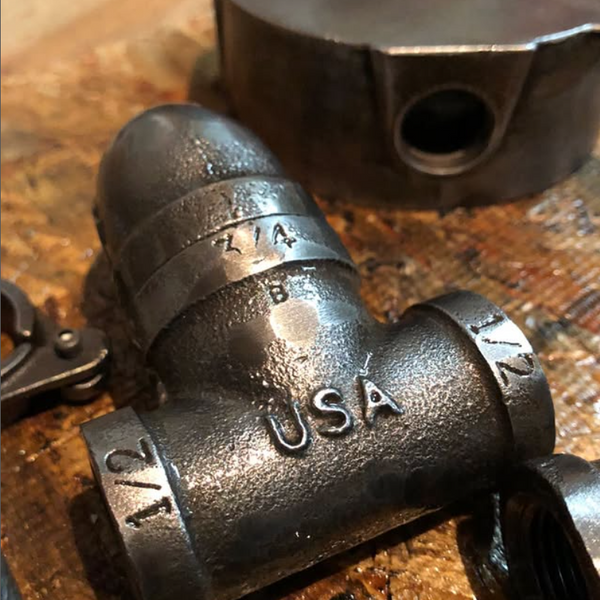 American-made reclaimed black pipe lighting for rustic decor