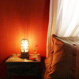 bedside lamp industrial metal cage on bedroom nightstand