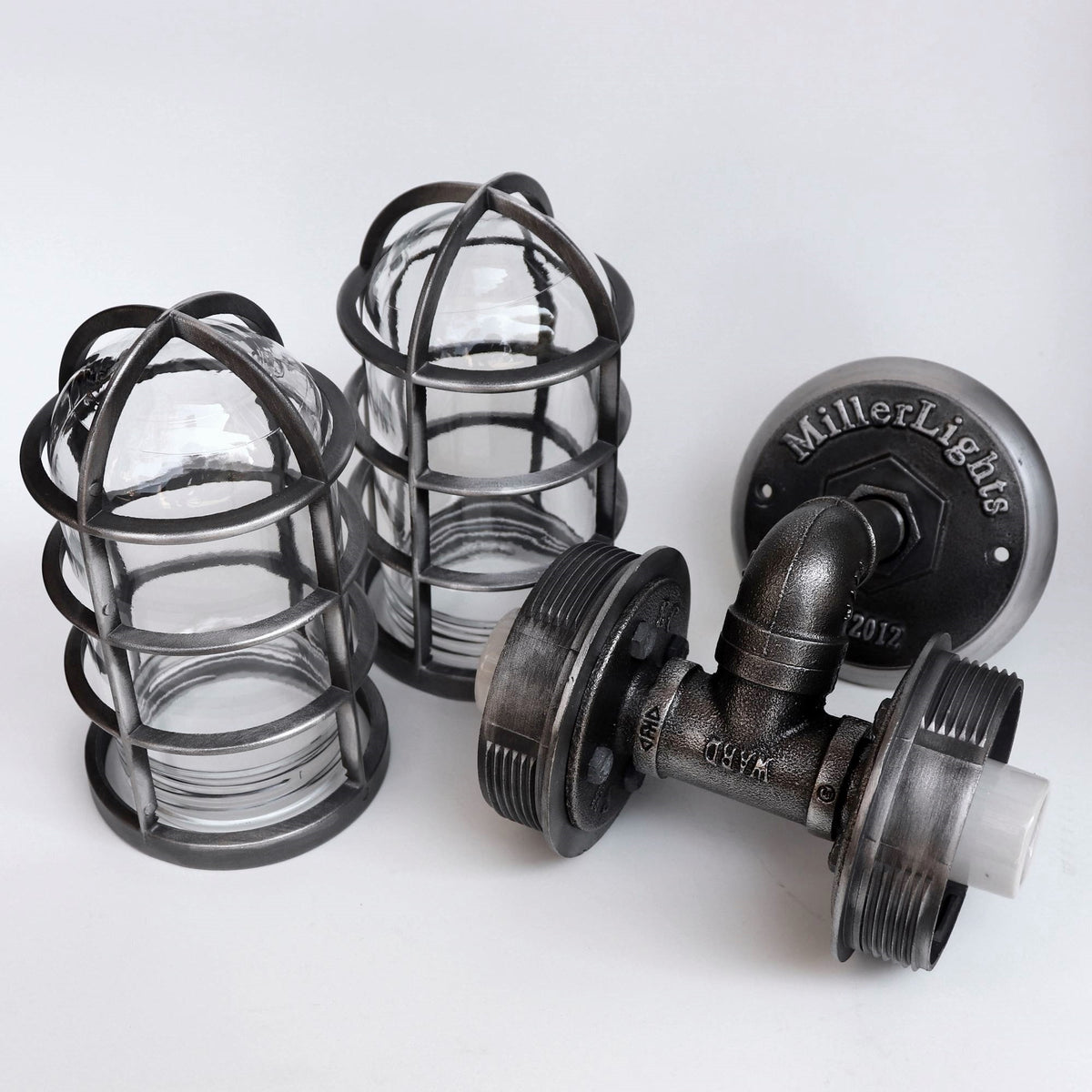 Vintage aesthetic iron pipe wall light with double glass globes and two bulbs