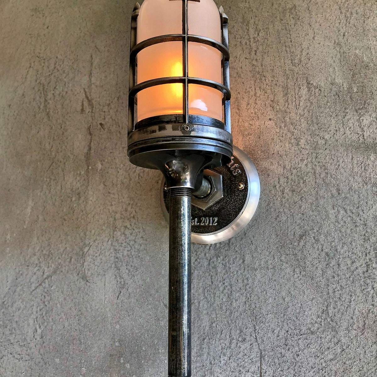torch industrial-style wall light with frosted glass and flame bulb