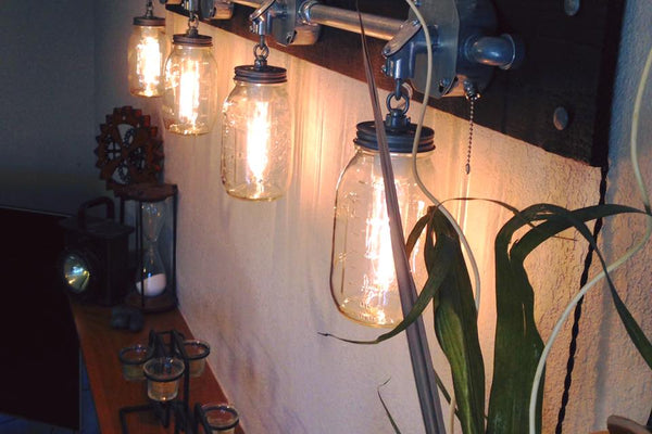 What height should wall sconces be mounted?