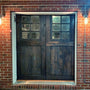 What height should sconces be next to door?