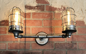 Vintage Industrial pipe wall light with 2 wire cages 