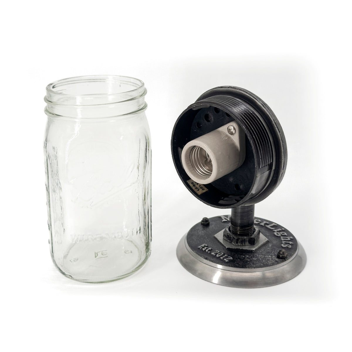 mason jar light features a vintage-style design with a clear glass jar, The metal components have a weathered, black finish, The base is engraved with "Miller Lights Est. 2012