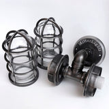 Disassembled view of the MillerLights industrial wall sconce showcasing the heavy-duty black iron pipe frame alongside two removable protective metal wire cages and clear glass globes.