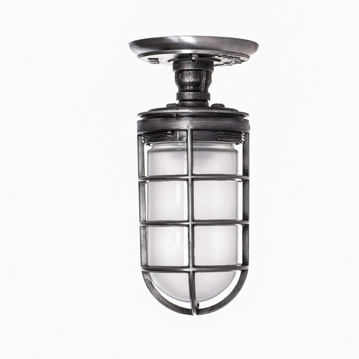 MillerLights 'The Beacon' industrial semi flush mount ceiling light fixture configured with an optional frosted glass jelly jar globe inside the antiqued steel metal cage for diffused, glare-free illumination.