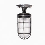 MillerLights 'The Beacon' industrial semi flush mount ceiling light fixture configured with an optional frosted glass jelly jar globe inside the antiqued steel metal cage for diffused, glare-free illumination.